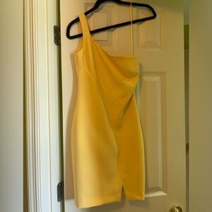 Yellow one shoulder likely dress